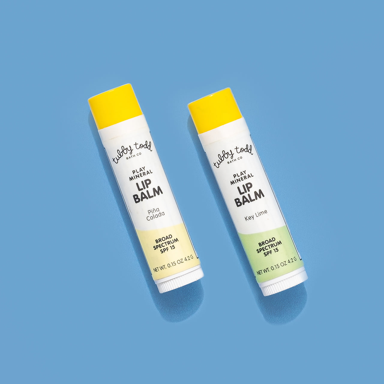 SPF Lip Balm 2-pack laying on the blue background.