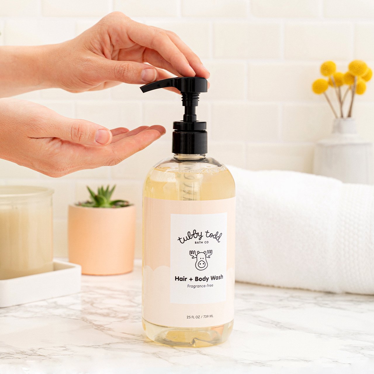 Fragrance-free Hair + Body Wash being used next to bathroom sink