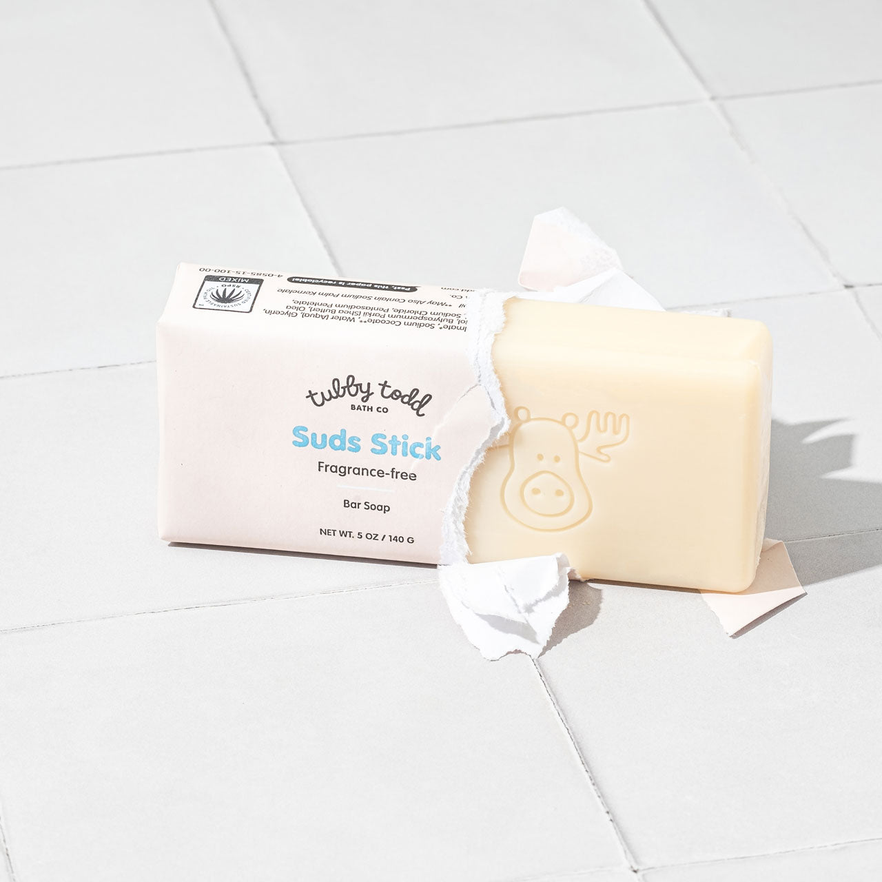 Suds Stick bar soap coming out of paper packaging
